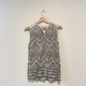 Small Button Down Woman’s Shirt With Embroidered Floral Pattern Around the Neck